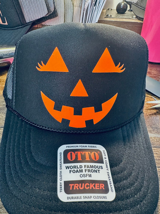 Girly Pumpkin Face Neon Orange 3D Puff Vinyl on a Black Unisex Foam Trucker Hat