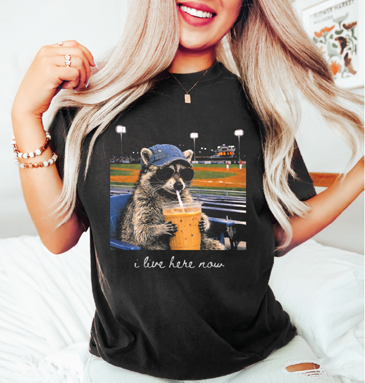 I Live Here Now Base/Softball Raccoon- Unisex Comfort Color Graphic Tee